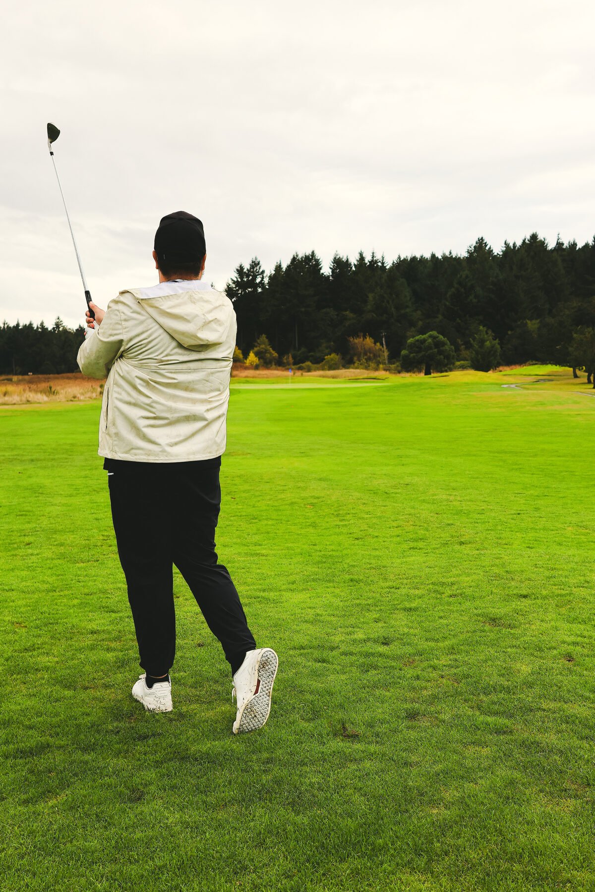 Follow through, driver wrapped, ball gone