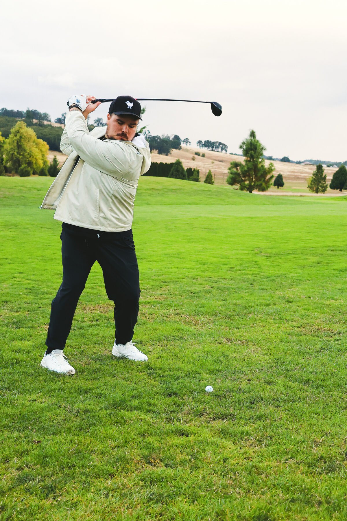Swing finishing high, valley opening up behind the green