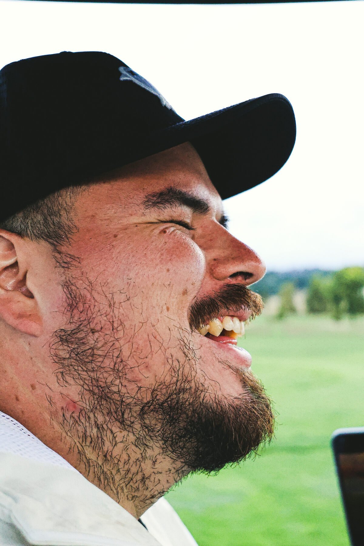 A golfer laughing between shots