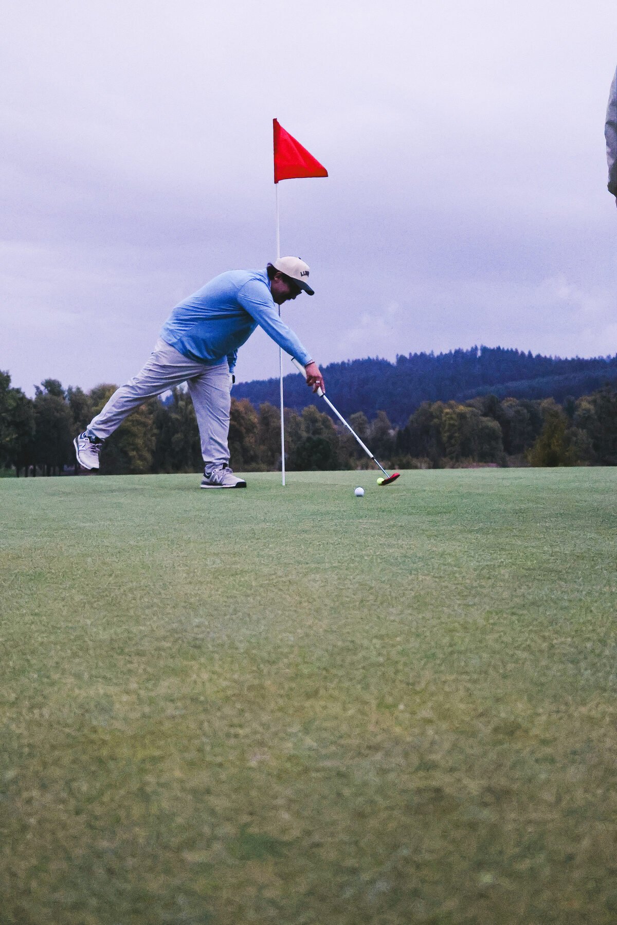Reading the line on the green beside the pin