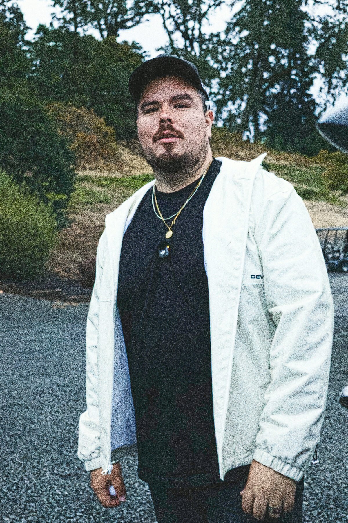 Portrait against the far bank, jacket open